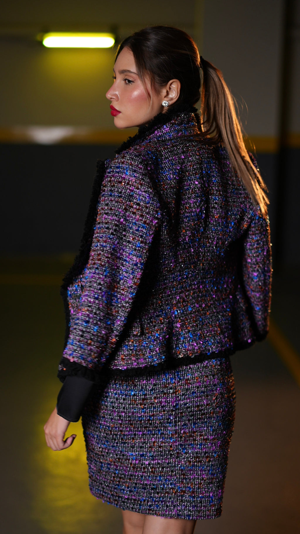  A sparkling multicolor tweed jacket and matching skirt.