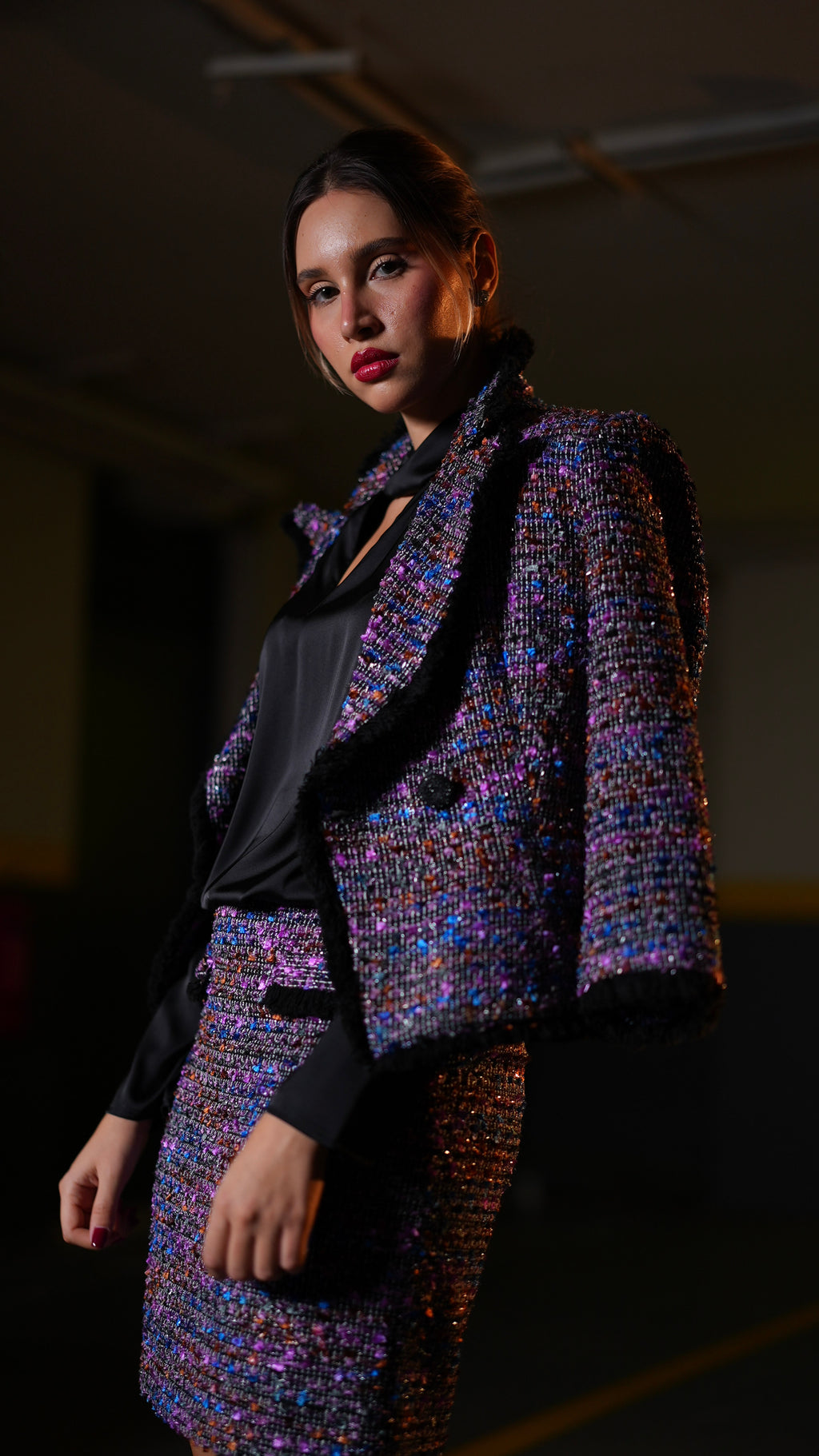 Matching tweed blazer and skirt set in a vibrant purple, blue, and pink iridescent pattern 