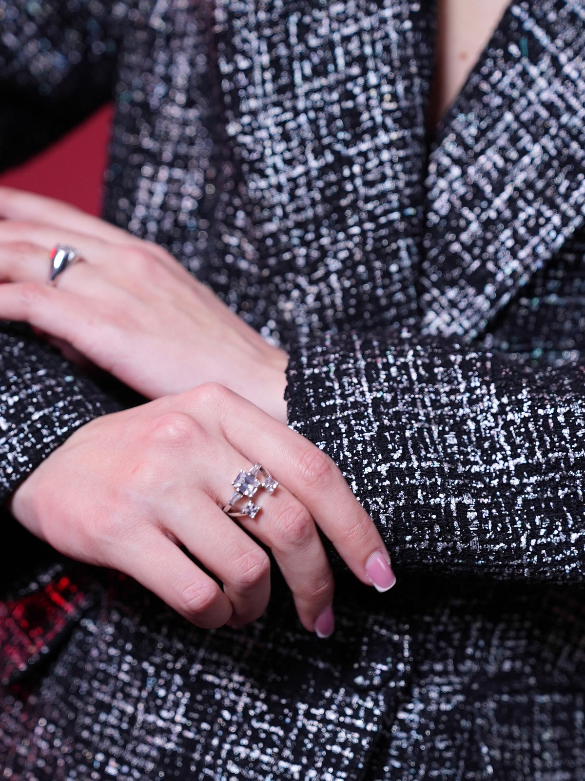 Close-up of black-and-white laminated tweed texture and lapel