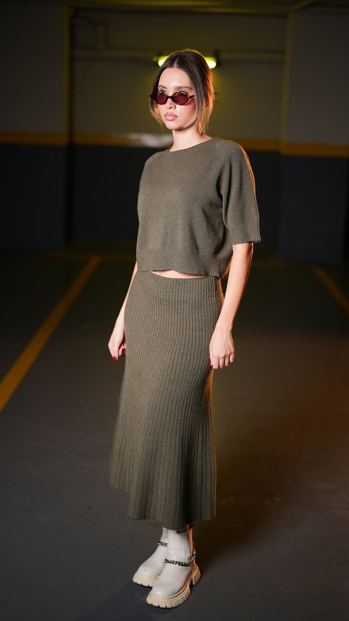 Full-length view of dark olive cropped top and midi skirt set