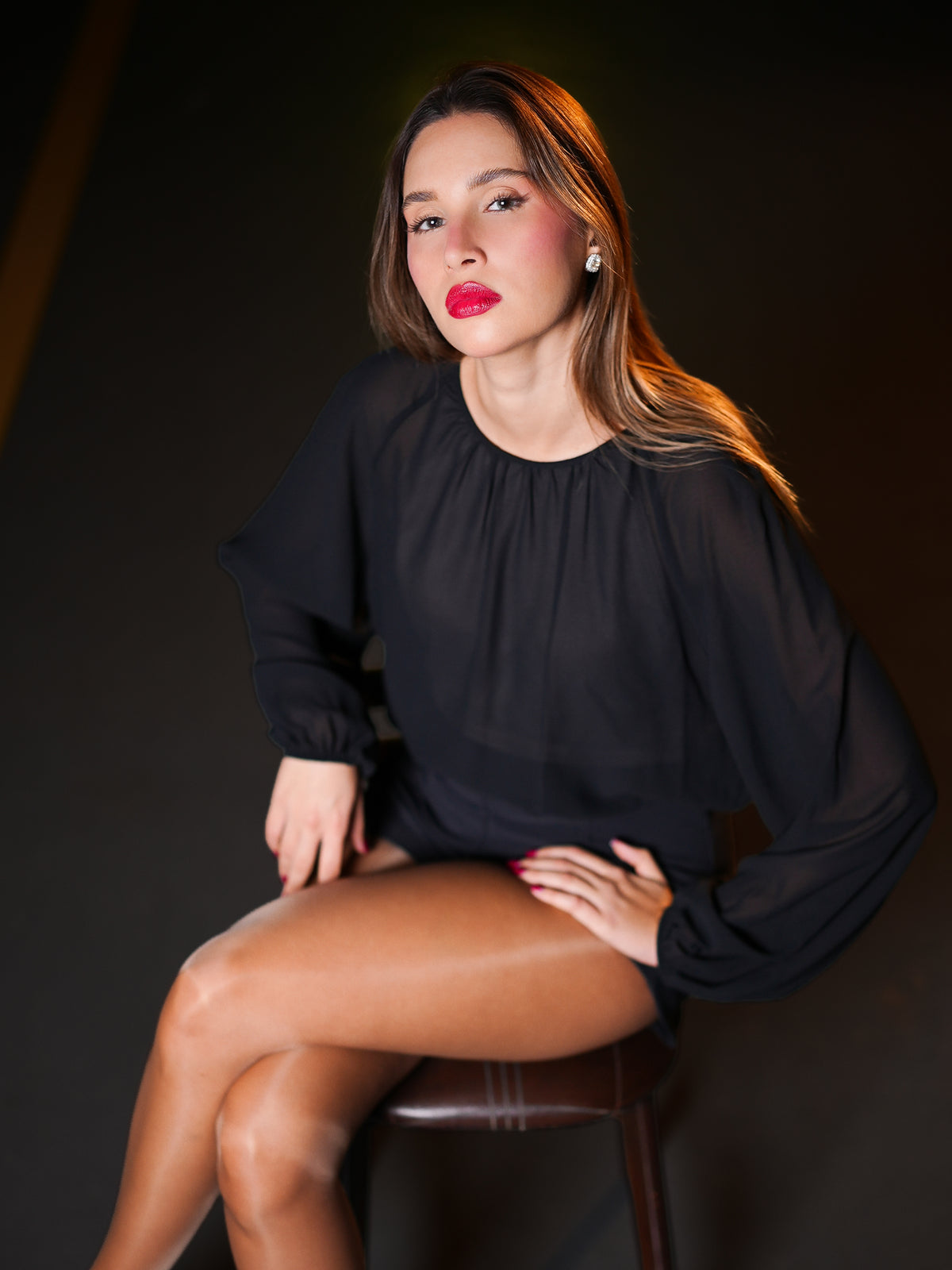Wearing a sheer black long-sleeve  overall